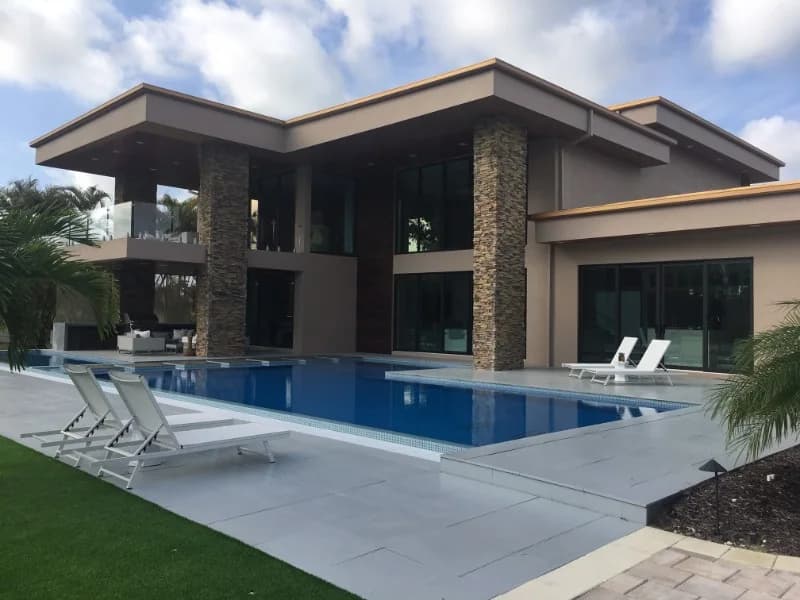 Modern Florida estate with infinity pool and full-height impact glass