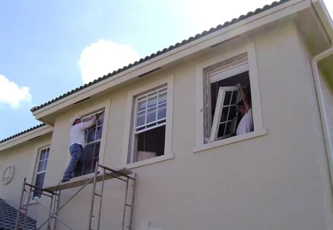 Impact window installation from scaffold