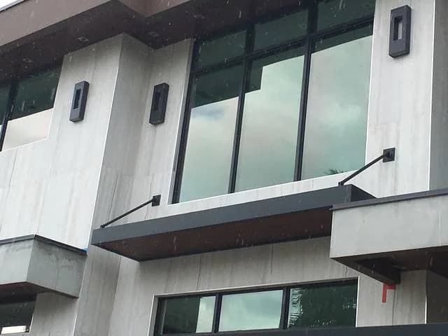 White modern facade with tall impact windows